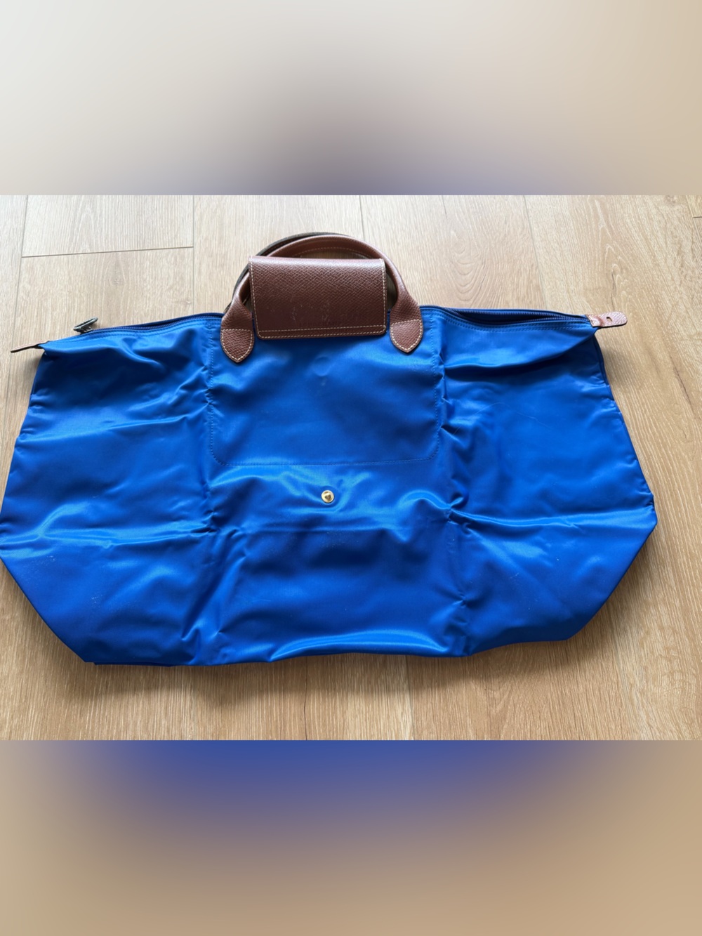 A Paris-exclusive hot-stamped Le Pliage Longchamp large tote.